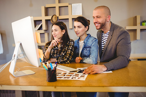 Team of graphic designer working on computer in the office