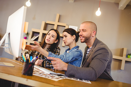 Team of graphic designer working on computer in the office