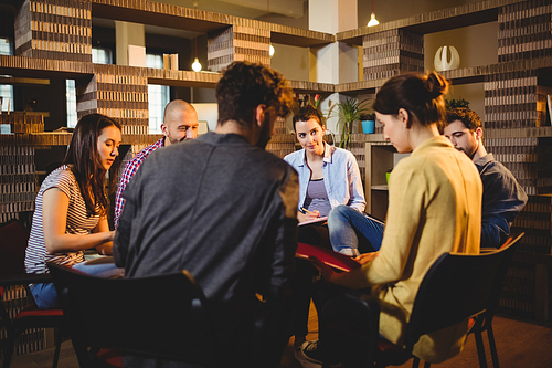 Colleagues having discussion at office