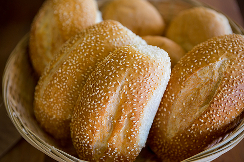Close-up of sesame breads in a basket at supermarket