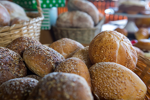 Close-up of sesame breads in a basket at supermarket