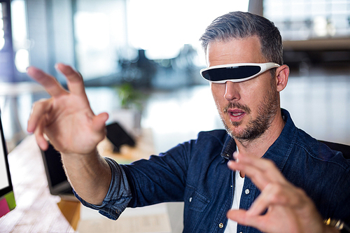 Man wearing virtual glass in creative office