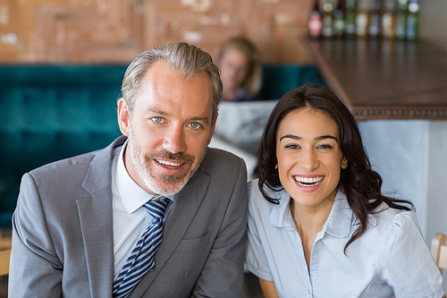 Portrait of business colleague smiling in restaurant
