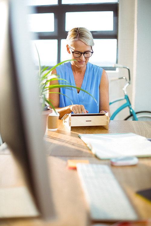 Business executive using digital tablet in office