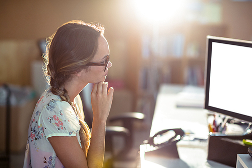 Woman working on computer in office