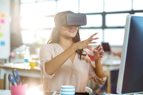 Businesswoman using virtual 3d glasses in office