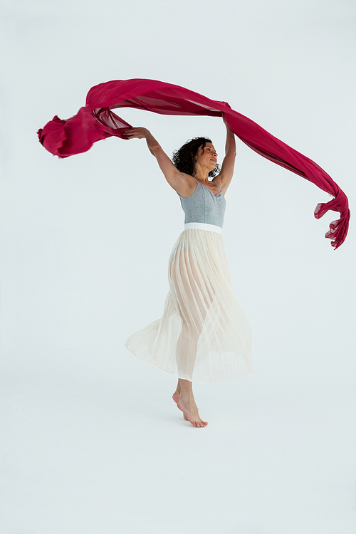 Dancer practicing contemporary dance in dance studio