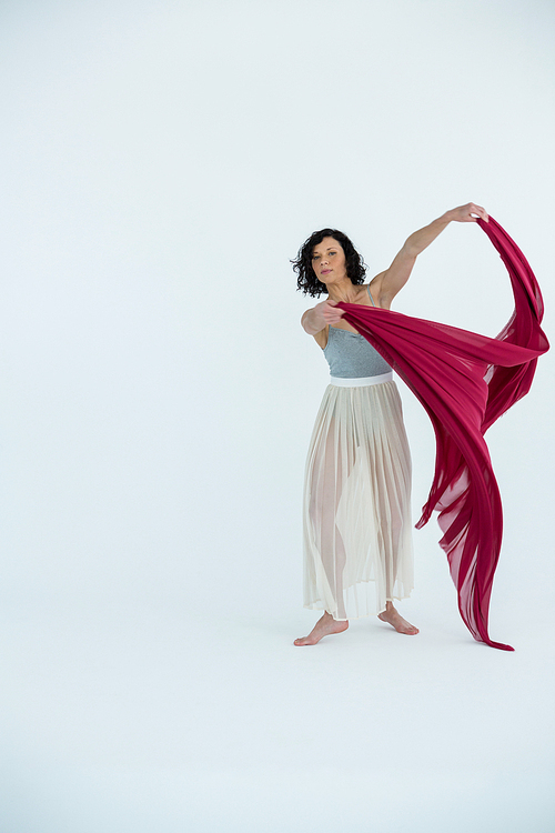 Dancer practicing contemporary dance in dance studio