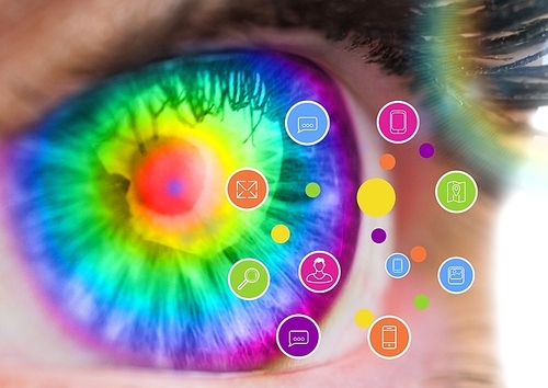 Close up of eye against digitally generated application icons against white background