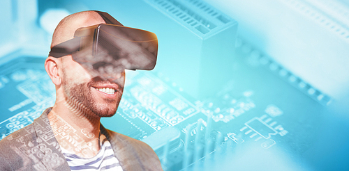 Man wearing virtual simulator headset against computer chip in circuit board