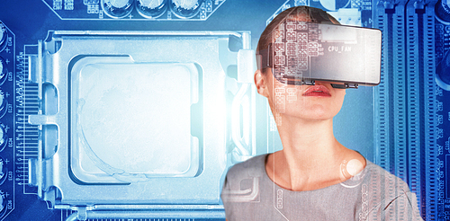Close up of woman using virtual reality simulator against close-up of circuit board