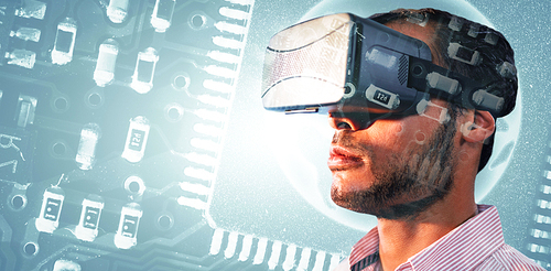 Close up of businessman holding virtual glasses against globe in circuit board