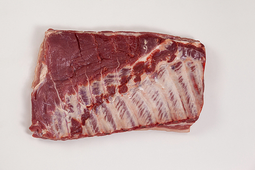 Close-up of beef brisket against white background