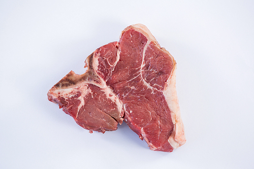 Close-up of sirloin chop against white background