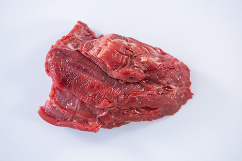 Close-up of beef steak against white background