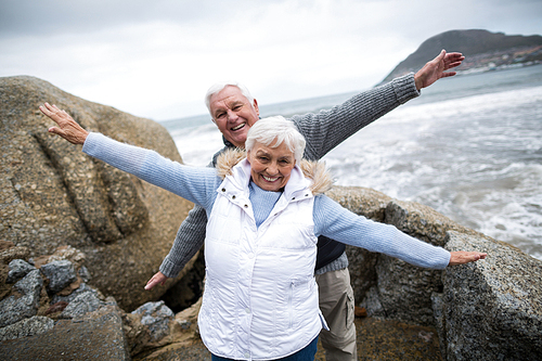 Senior couple enjoying together on beach