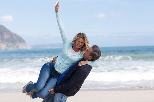 Romantic mature couple enjoying on the beach