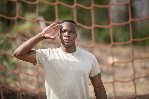 military soldier giving salute during obstacle course in 군사훈련