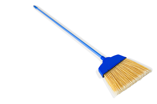 Close-up of long handle broom against white background