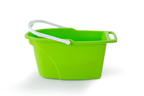 Close-up of green bucket against white background