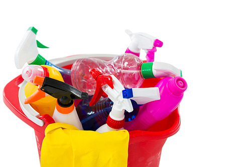 High angle view of cleaning spary and bottles in bucket against white background