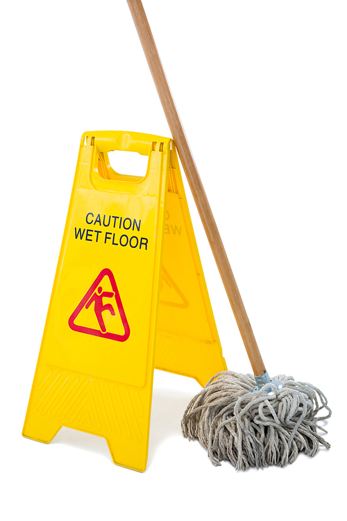 Close up of wet floor sigh board with mop against white background