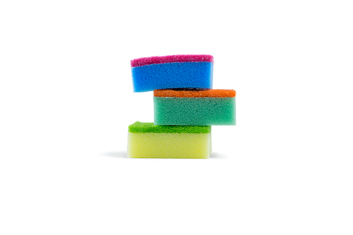 Stack of colorful sponge against white background