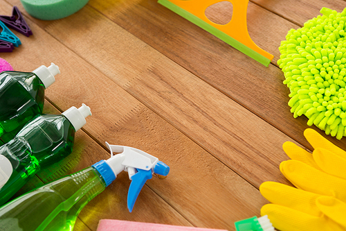 High angle view of various cleaning products on wooden table
