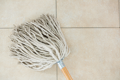 Close up of mop on tiled floor