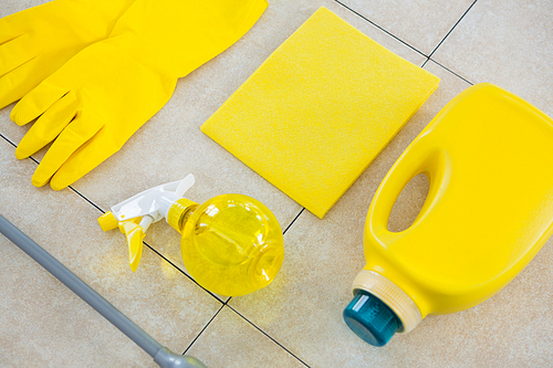 Close up of yellow cleaning equipment on tiled floor