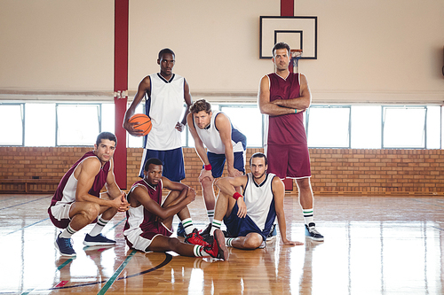 Portrait of confident basketball players in the court