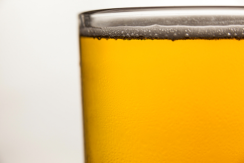 Close-up of st Patricks day mug of beer on white background