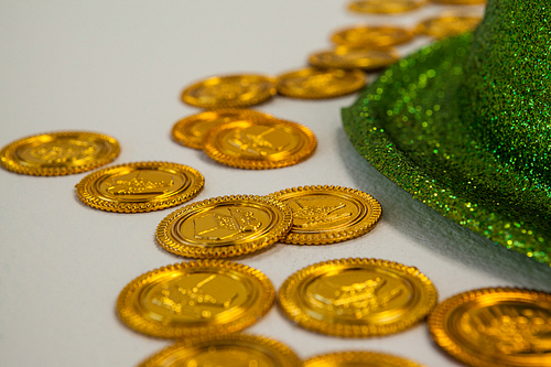 St Patricks Day leprechaun hat with gold chocolate coins??on white background