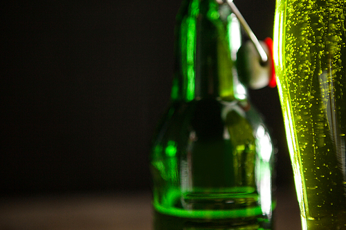 Close-up of green beer and beer bottle for St Patricks Day