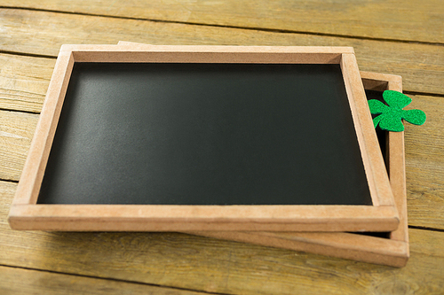 St Patricks Day shamrock on the slate on wooden table