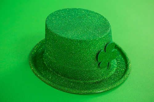 St Patricks Day leprechaun hat with shamrock on green background