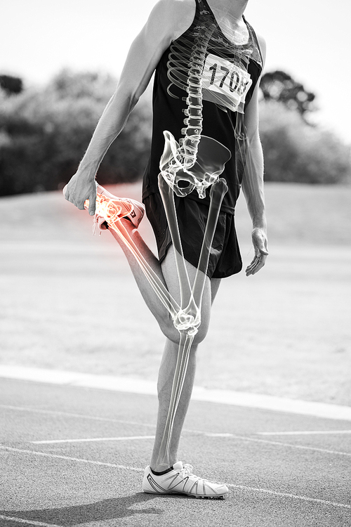 Digital composite of highlighted bones of athlete man stretching on race track
