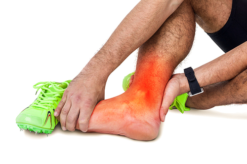 Digital composite of highlighted leg of injured man against white background