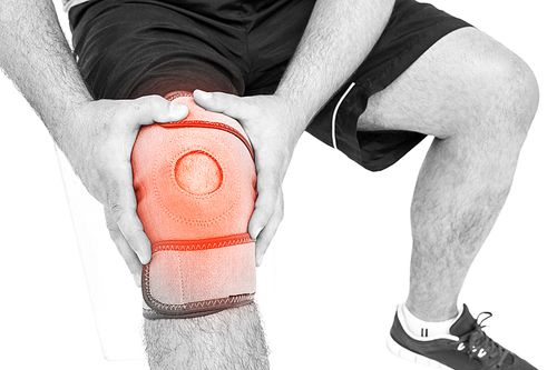 Digitally composite image of man suffering with knee cramp against white background