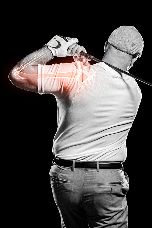 Digitally generated image of male golfer practicing against black background