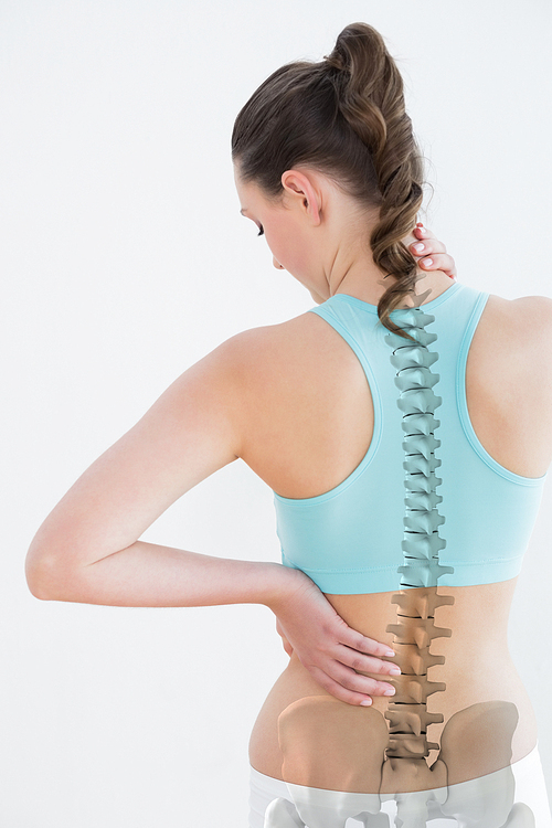 Rear view of woman suffering from neck pain against white background