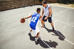 High angle view of basketball players playing in court