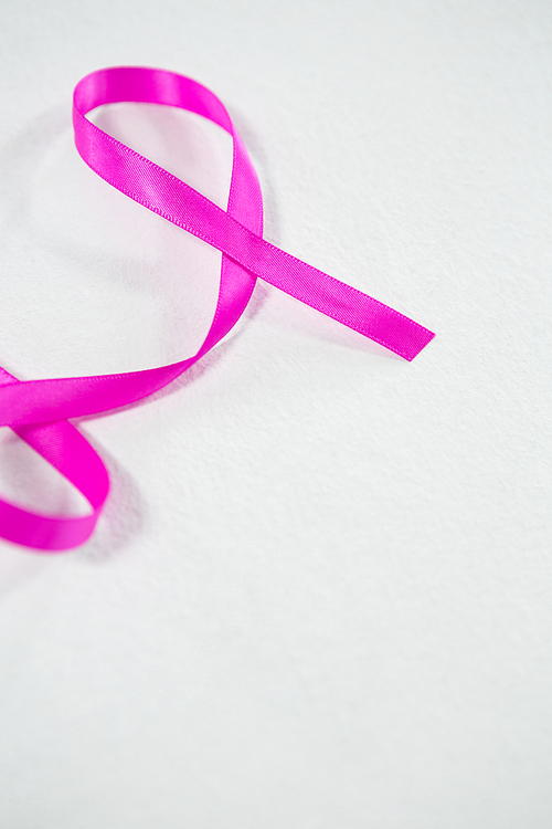 High angle view of Breast Cancer pink ribbon against white background