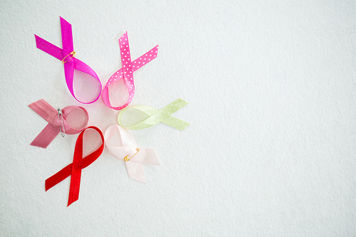 Overhead view of arranged various awareness ribbons on white background