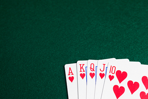 Playing cards arranged on poker table in casino