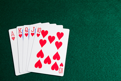 Playing cards arranged on poker table in casino