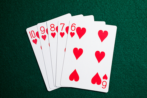 Playing cards arranged on poker table in casino