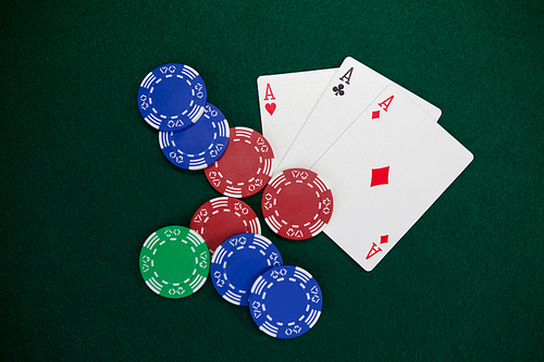 Playing cards and casino chips on poker table in casino