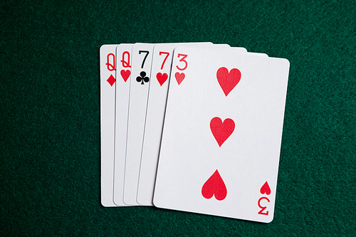 Playing cards arranged on poker table in casino