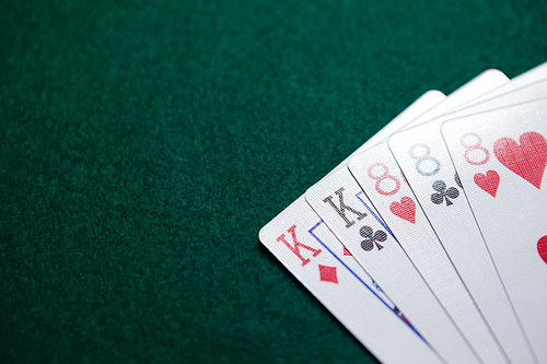 Playing cards arranged on poker table in casino